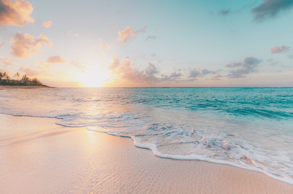 Warm beach shoreline for a February escape from New York for Cheap Warm Places to Visit in February from NYC